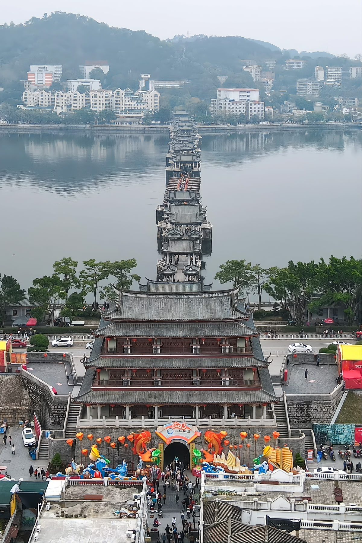The Guangji Gate tower and the eastern approach of Guangji Bridge, seen from below with the river beyond
