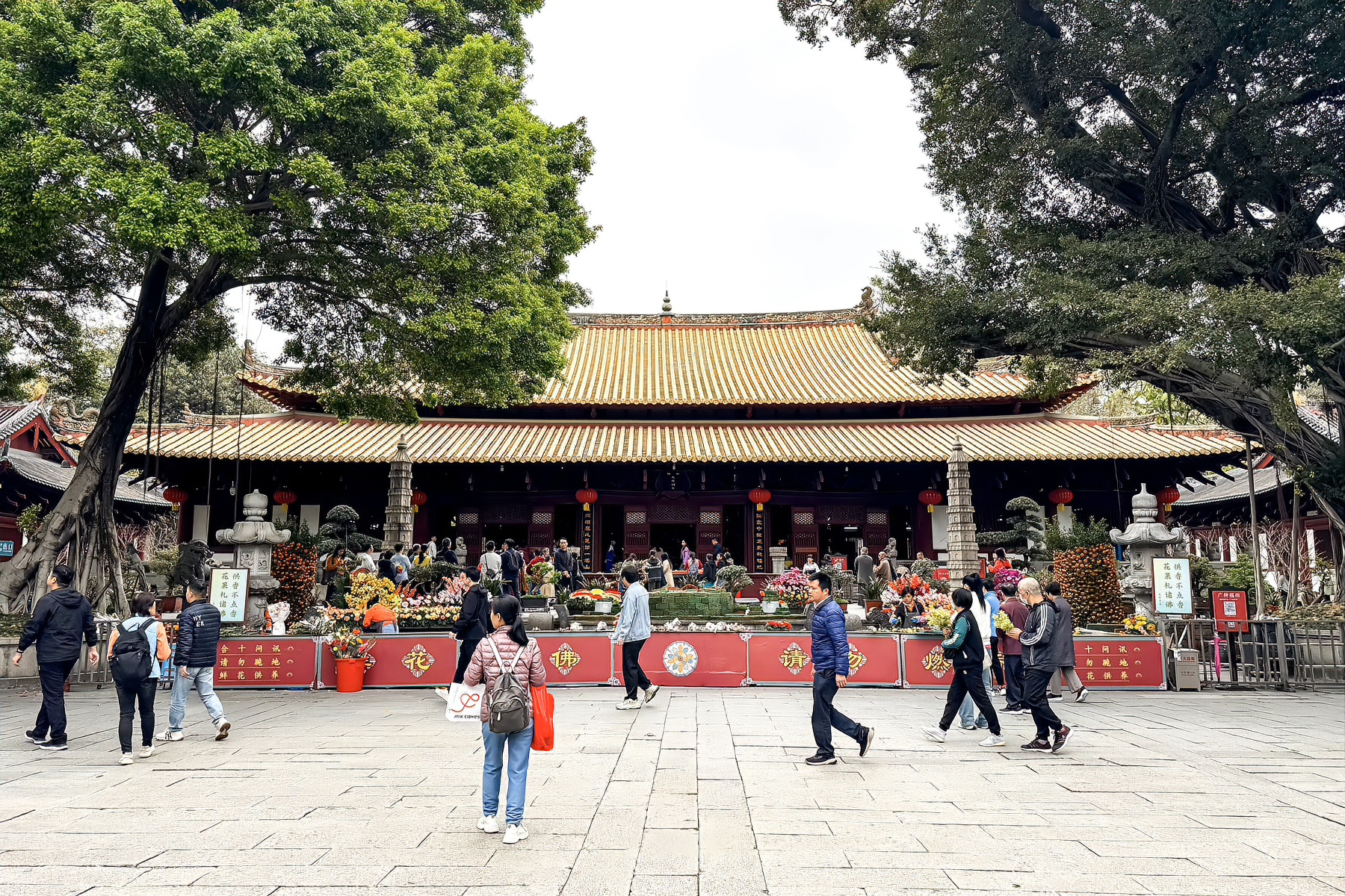 The main courtyard of Guangxiao Temple with the great hall and banners