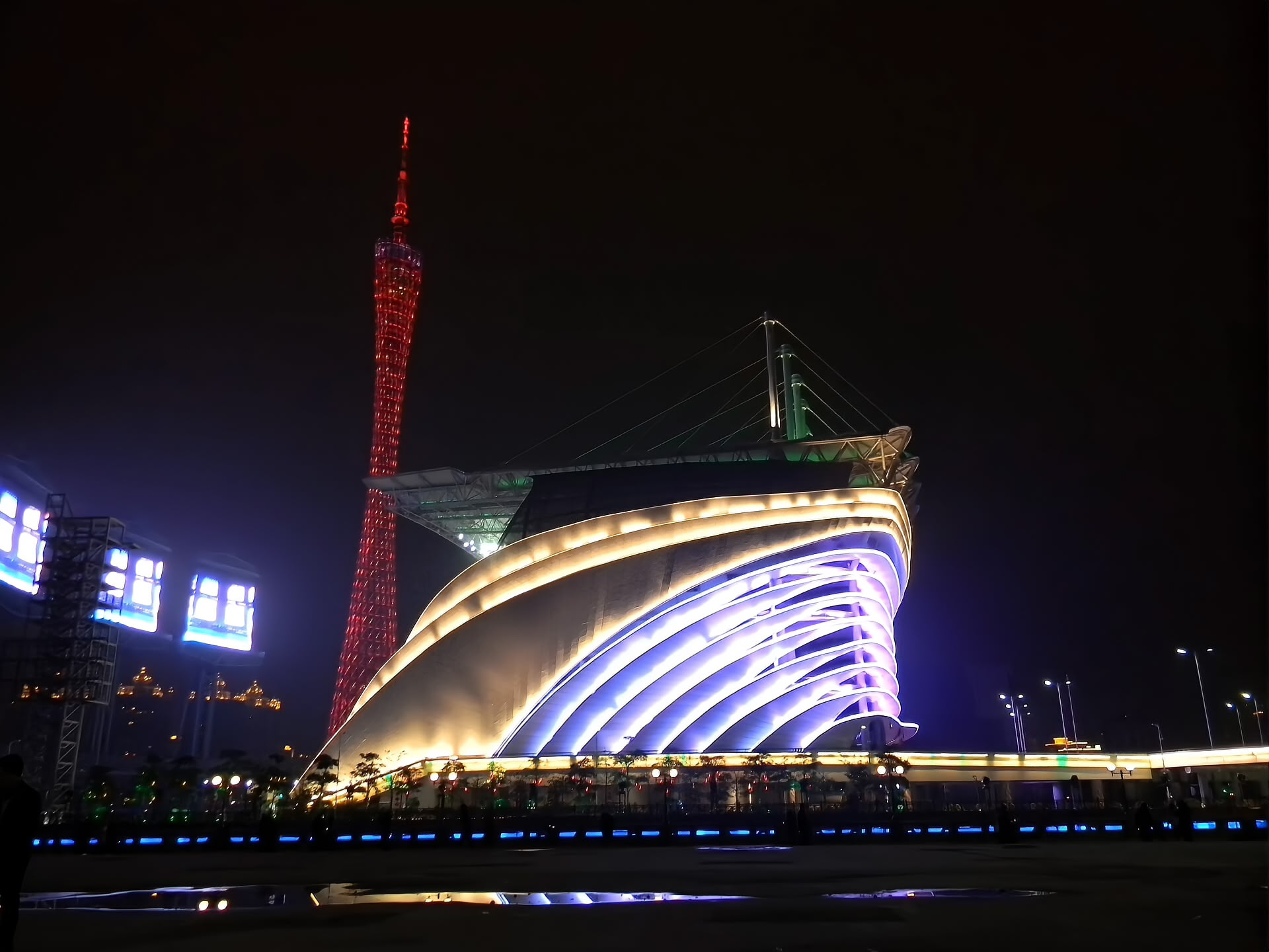 Guangzhou Opera House designed by Zaha Hadid, with Canton Tower behind
