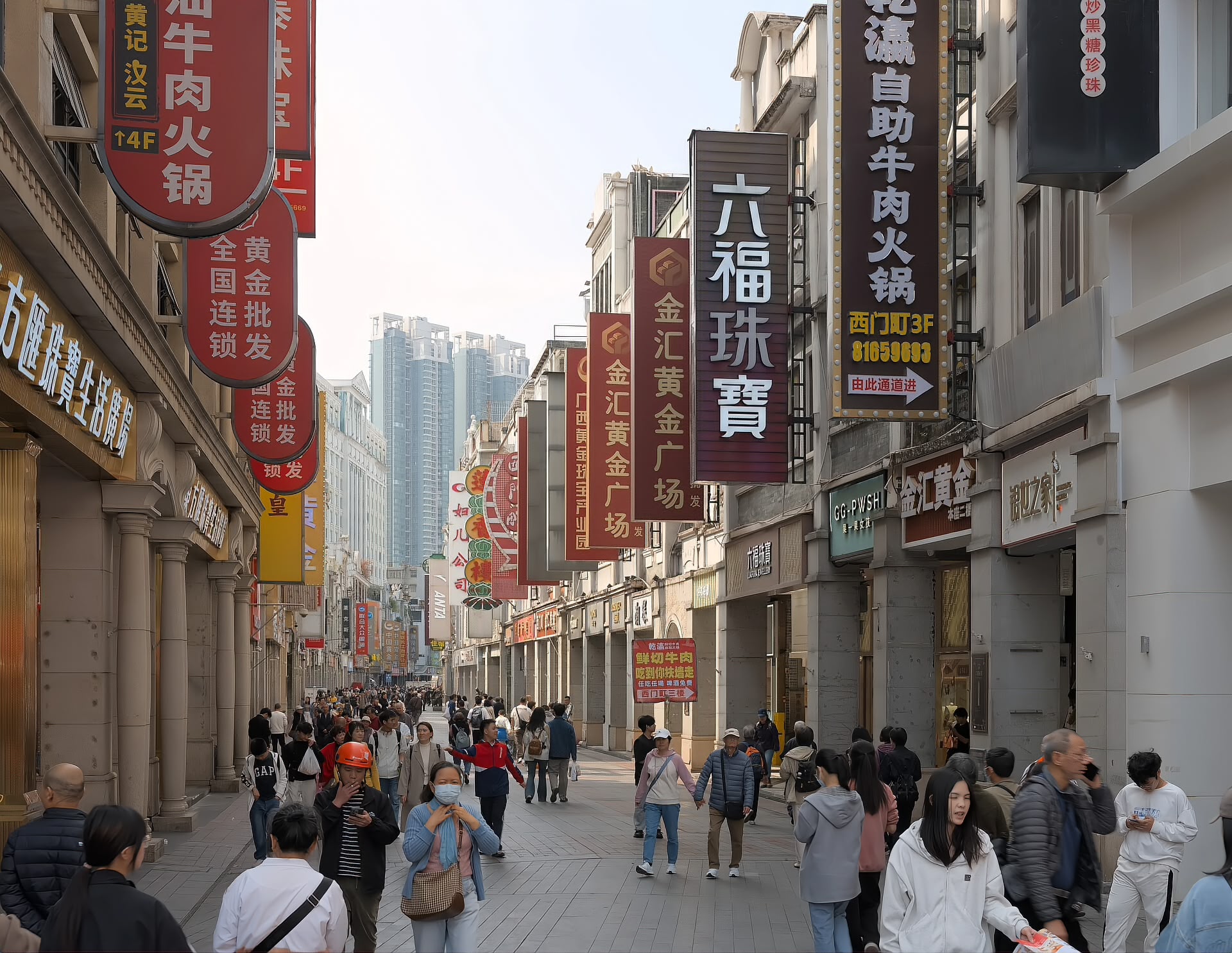 Shangxiajiu Pedestrian Street in Liwan, Guangzhou, with pedestrians and storefront signs