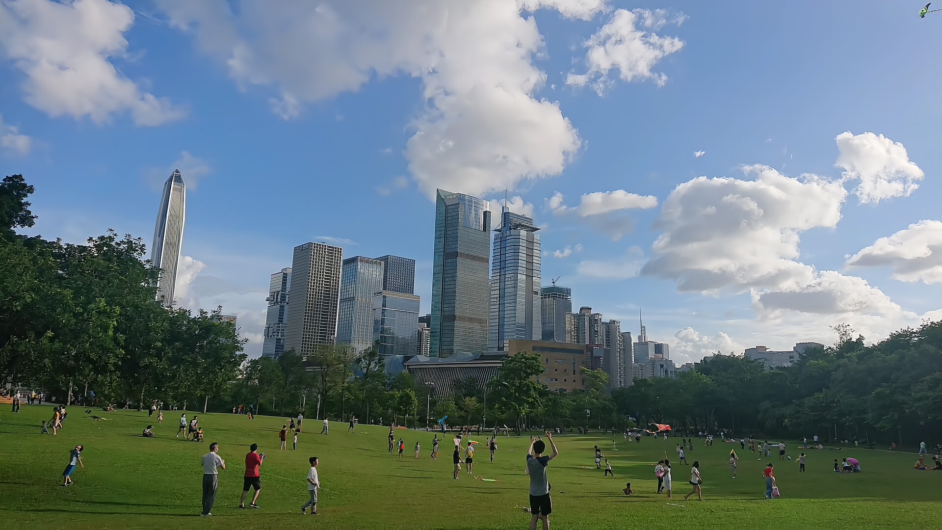View over Lianhuashan Park toward the Futian skyline with the green slopes in the foreground, Shenzhen