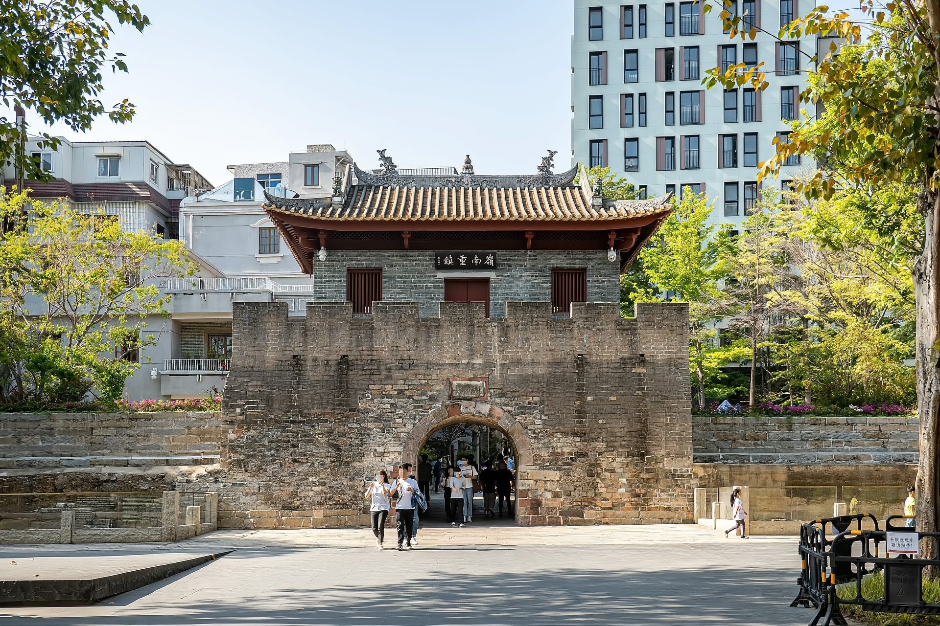 The reconstructed south gate of Nantou Old Town with its stone arch and tiled roof, Shenzhen