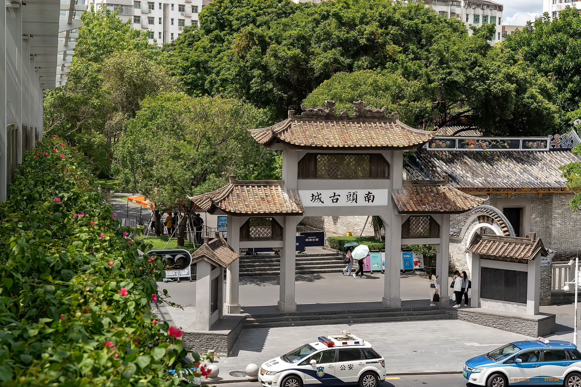 The paifang gateway at Nantou Old Town in Nanshan, Shenzhen, with the modern city behind it