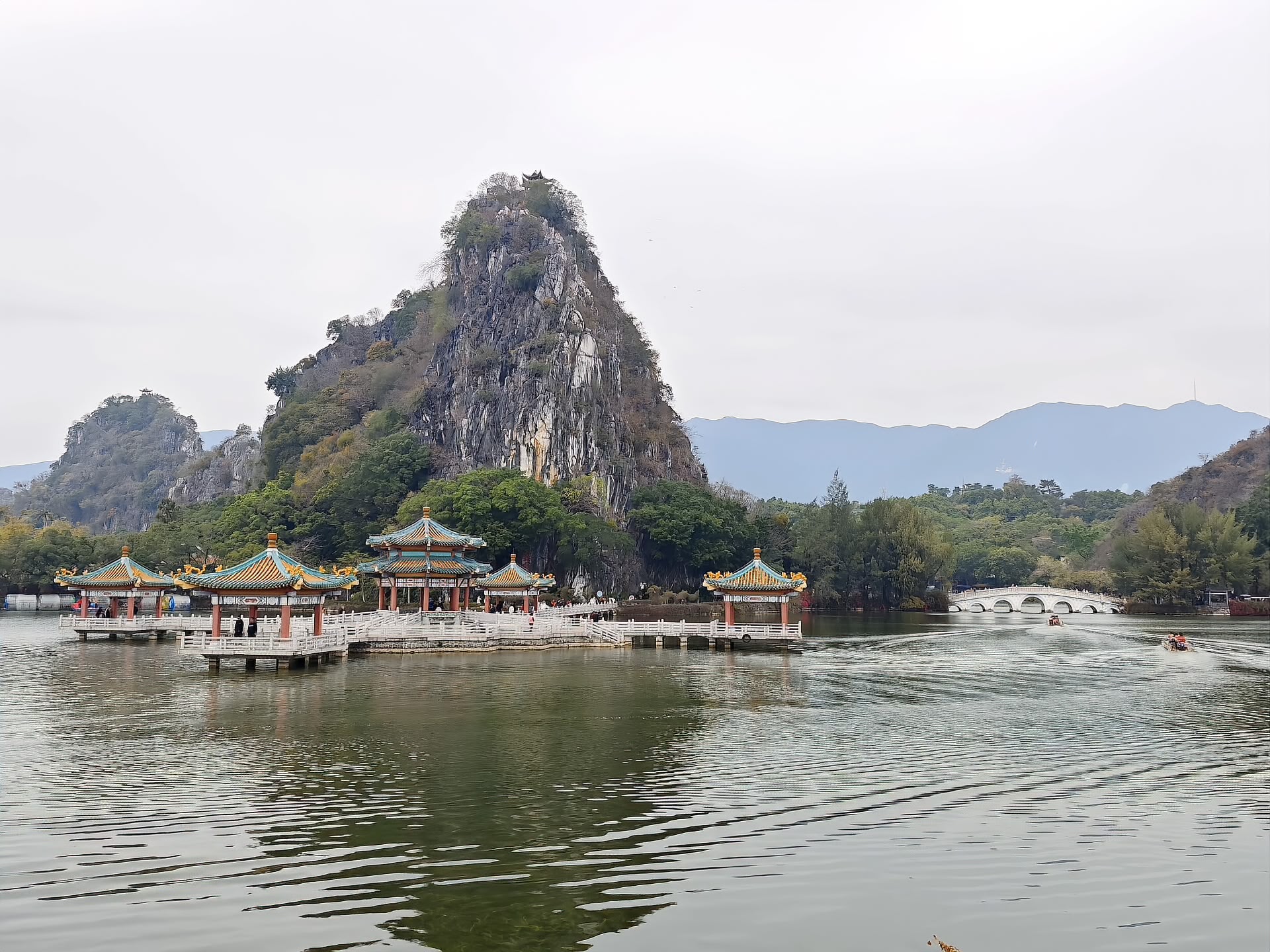 The Wulong Pavilion and Qixing Bridge on Star Lake with the limestone crags behind, Zhaoqing