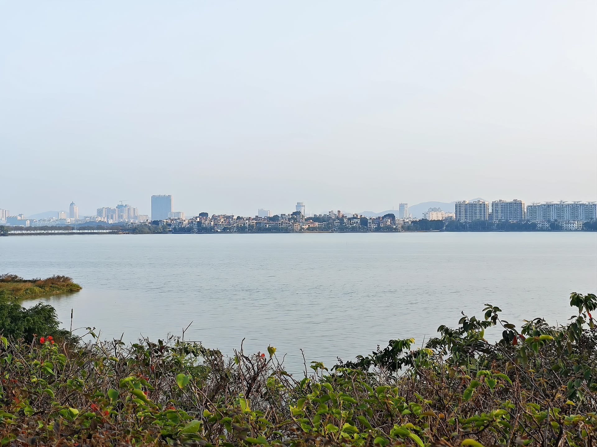 Star Lake with the Zhaoqing city skyline beyond the crags